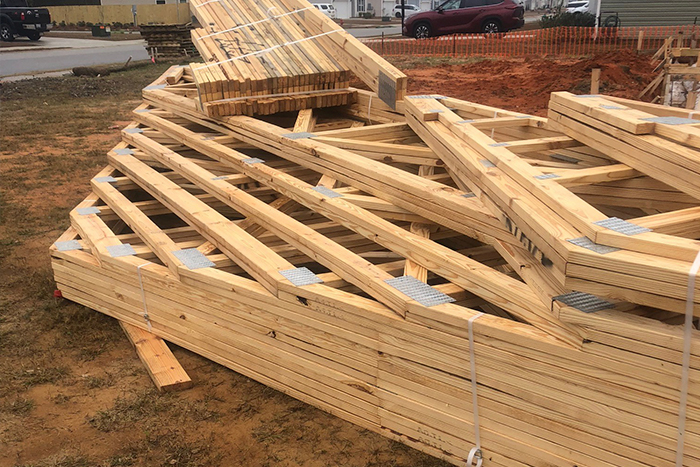 Bracing does not meet Baldwin County Building Code and trusses subjected to the elements